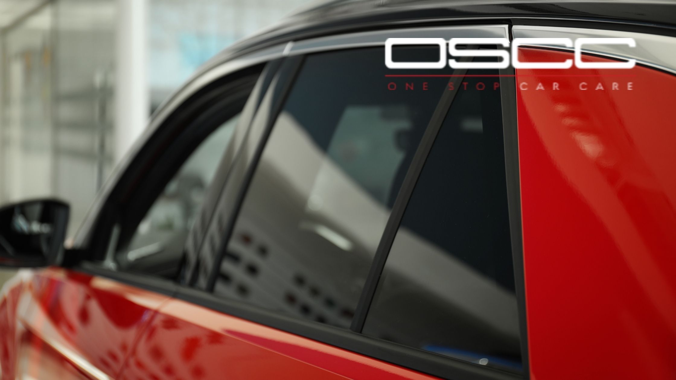 Red car with professionally tinted side windows at One Stop Car Care in Surrey, BC